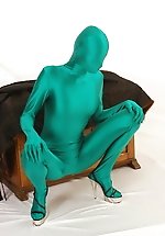 Bizarre green spandex girl stripping down clothes